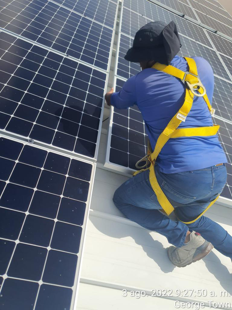 GreenTech installer fitting solar panels